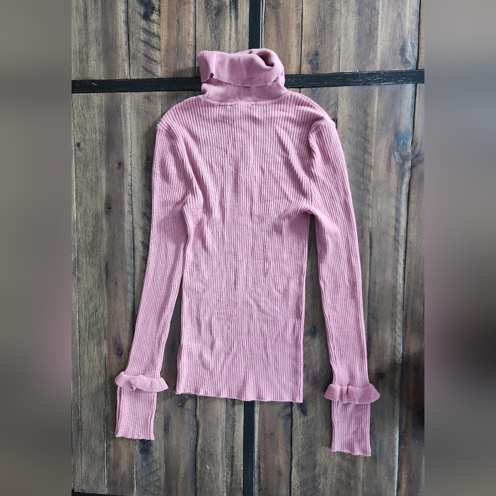 Express pink fitted turtleneck with ruffles and rhinestone sleeve button detail